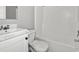 This bathroom features a bright white tub, a sink, and a toilet at 1533 Sand Dollar Ln., Garden City Beach, SC 29576