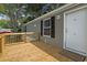 Wooden deck and entrance to gray mobile home at 1533 Sand Dollar Ln., Garden City Beach, SC 29576