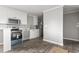 Modern kitchen with stainless steel appliances and white cabinets at 1533 Sand Dollar Ln., Garden City Beach, SC 29576