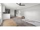 Open living room and kitchen area with gray walls and wood floors at 1533 Sand Dollar Ln., Garden City Beach, SC 29576