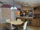 Dining area with octagonal table and kitchen access at 201 Melody Gardens Dr., Surfside Beach, SC 29575