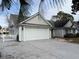 Single-story house with attached garage and landscaped yard at 201 Melody Gardens Dr., Surfside Beach, SC 29575