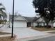 House exterior showcasing a neat lawn and driveway at 201 Melody Gardens Dr., Surfside Beach, SC 29575