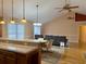 Kitchen with island, hardwood floors, and vaulted ceiling at 201 Melody Gardens Dr., Surfside Beach, SC 29575