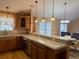 Spacious kitchen with wooden cabinets and island at 201 Melody Gardens Dr., Surfside Beach, SC 29575