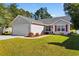 Gray house with a two-car garage and manicured lawn at 244 Mckendree Ln., Myrtle Beach, SC 29579