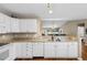 Kitchen with granite counters, white cabinets, and view to backyard at 244 Mckendree Ln., Myrtle Beach, SC 29579