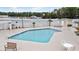 Community pool with hot tub, seating area, and nearby building at 248 Sun Colony Blvd. # A-305, Longs, SC 29568