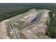 New construction community aerial showcases spacious lots and planned infrastructure surrounded by lush forestry at 25 Northbrook Dr, Murrells Inlet, SC 29576