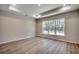 This bedroom with recessed lighting boasts large windows and wood-look flooring at 25 Northbrook Dr, Murrells Inlet, SC 29576