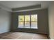 Bright bedroom featuring a large window and new flooring at 25 Northbrook Dr, Murrells Inlet, SC 29576