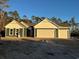 Newly constructed home with a two-car garage and attractive curb appeal at 25 Northbrook Dr, Murrells Inlet, SC 29576