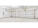 Spacious two-car garage with overhead doors and ample room for parking at 25 Northbrook Dr, Murrells Inlet, SC 29576