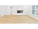 Bright open living space with wood floors and a modern fireplace at 25 Northbrook Dr, Murrells Inlet, SC 29576