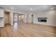 Bright open living space with wood floors and a modern fireplace at 25 Northbrook Dr, Murrells Inlet, SC 29576