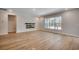 Open living area with bright windows, wood floors and modern fireplace at 25 Northbrook Dr, Murrells Inlet, SC 29576