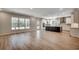 Spacious living area with wood floors and large windows that bring in natural light at 25 Northbrook Dr, Murrells Inlet, SC 29576