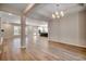 Open-concept living space with wood floors and kitchen island in the background at 25 Northbrook Dr, Murrells Inlet, SC 29576