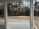 Screened porch with trees in the background at 25 Northbrook Dr, Murrells Inlet, SC 29576