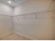 Simple walk-in closet with basic wire shelving and neutral walls at 25 Northbrook Dr, Murrells Inlet, SC 29576
