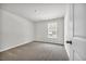 Bright bedroom with neutral carpeting and a window at 274 Columbus St., Conway, SC 29526