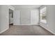 Simple bedroom with neutral carpeting and two doors at 274 Columbus St., Conway, SC 29526