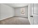 Spacious bedroom with neutral carpeting and large window at 274 Columbus St., Conway, SC 29526