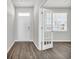 Bright entryway with open door to an office and wood-look flooring at 274 Columbus St., Conway, SC 29526