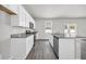 Modern kitchen with white cabinets and granite countertops at 274 Columbus St., Conway, SC 29526