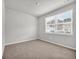 Spacious bedroom with neutral carpeting and large window at 275 Columbus St., Conway, SC 29526