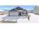 Gray siding house with white garage door and snow covered lawn at 275 Columbus St., Conway, SC 29526