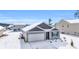 Gray siding house with white garage door and snow covered lawn at 275 Columbus St., Conway, SC 29526