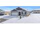 Gray siding house with white garage door and snow covered lawn at 275 Columbus St., Conway, SC 29526