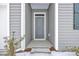 Gray front door with white trim and small window at 275 Columbus St., Conway, SC 29526