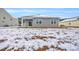 Gray siding house exterior with snowy backyard at 275 Columbus St., Conway, SC 29526