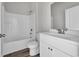 Clean bathroom with white vanity, tub, and shower at 281 Columbus St., Conway, SC 29526