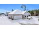 Tan house with white garage door, snow on the ground at 281 Columbus St., Conway, SC 29526