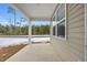 Covered front porch with view of wooded area at 281 Columbus St., Conway, SC 29526