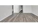 Bright hallway with wood-look flooring leading to other rooms at 281 Columbus St., Conway, SC 29526