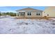 Tan house exterior with covered patio and snowy yard at 281 Columbus St., Conway, SC 29526