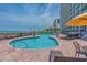 Relaxing pool area with ample lounge chairs at 3000 N Ocean Blvd. # 2002, Myrtle Beach, SC 29577