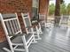 Cozy covered porch with comfortable rocking chairs and outdoor seating, perfect for relaxing at 305 W Raft St., Nichols, SC 29581