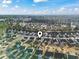 Aerial view of a residential area featuring houses, trees and a bright sky at 3141 Shorecrest Bay Dr., Murrells Inlet, SC 29576