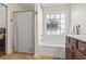 Bathroom with tub and shower featuring a privacy window and wood-finish vanity at 3141 Shorecrest Bay Dr., Murrells Inlet, SC 29576