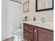 Bathroom featuring a vanity and a toilet with flowers and signage at 3141 Shorecrest Bay Dr., Murrells Inlet, SC 29576