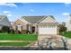 Charming single-story home with a brick facade, well-manicured lawn, and attached two-car garage at 3141 Shorecrest Bay Dr., Murrells Inlet, SC 29576