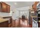 Spacious kitchen with stainless steel appliances, decorative glass doors, and stylish hardwood floors at 3141 Shorecrest Bay Dr., Murrells Inlet, SC 29576