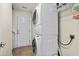 Laundry Room featuring a stacked washer and dryer near a white door at 3141 Shorecrest Bay Dr., Murrells Inlet, SC 29576