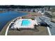 Aerial view of community pool, lake, clubhouse, and playground at 3409 Ashridge Way, Conway, SC 29526