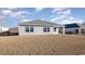 Rear view of the home with a large backyard, metal fence, and covered patio at 3409 Ashridge Way, Conway, SC 29526